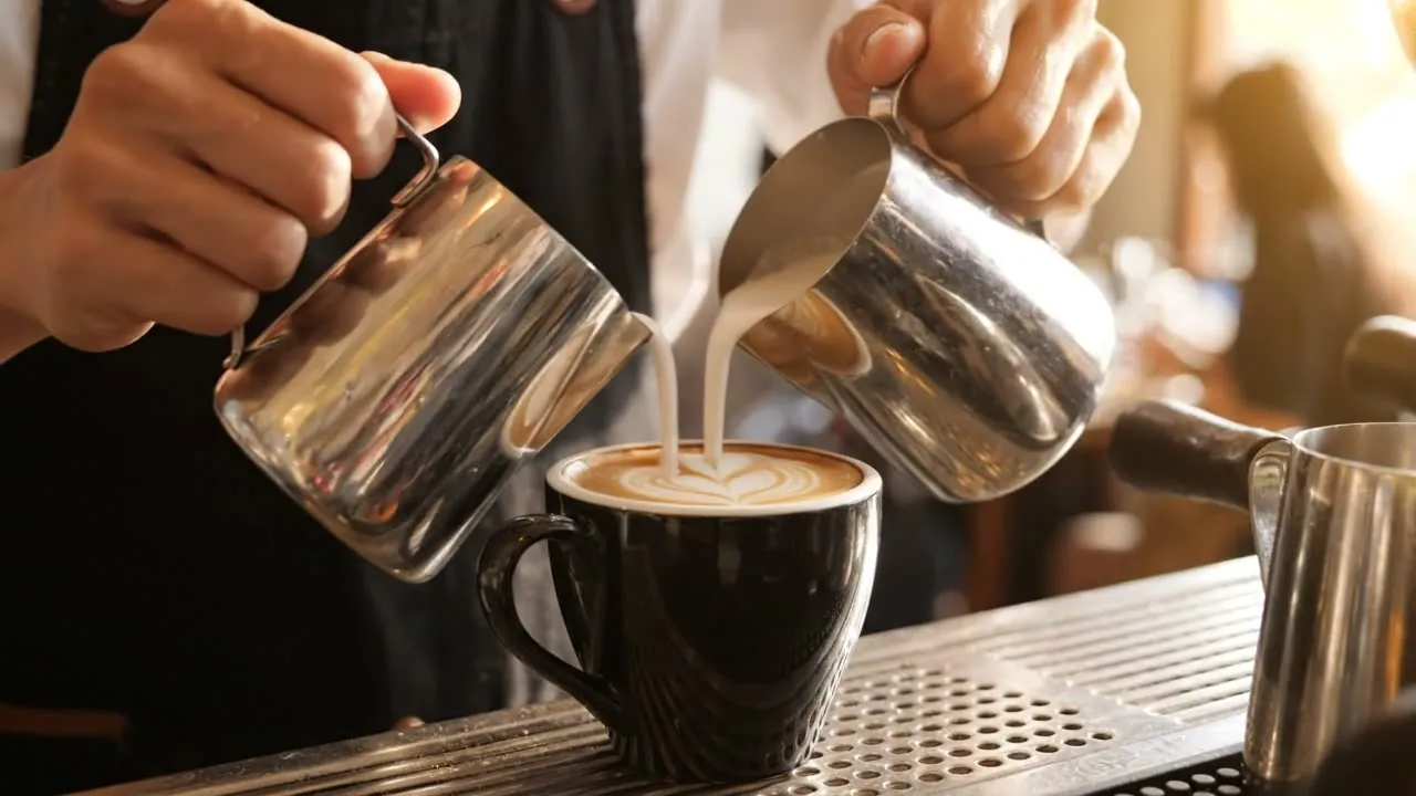 Veo 3 API sample: latte art poured in a sunny café, a frame from a four-second Veo 3.1 Lite clip with sound